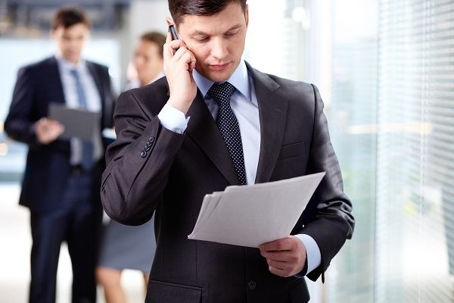 attorney on phone reading document