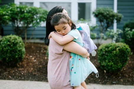 girl hugging her mother