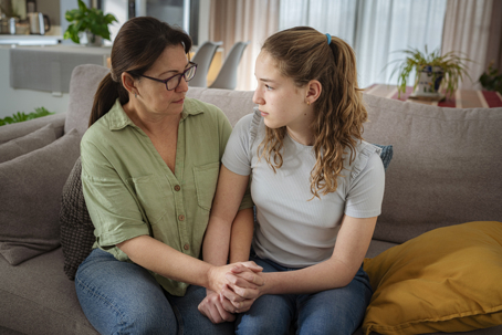 mother talking to teen daughter